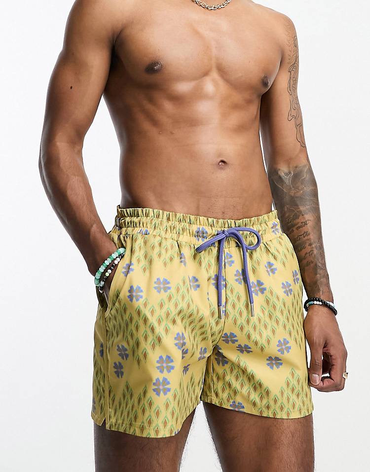 Reclaimed Vintage swim shorts in short length in geo floral print